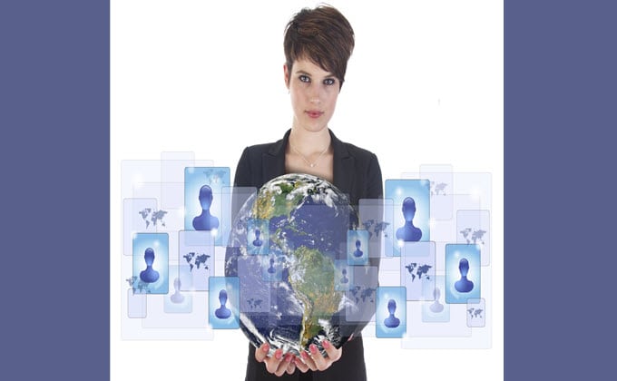 A woman holding a globe with people on it for LinkedIn.