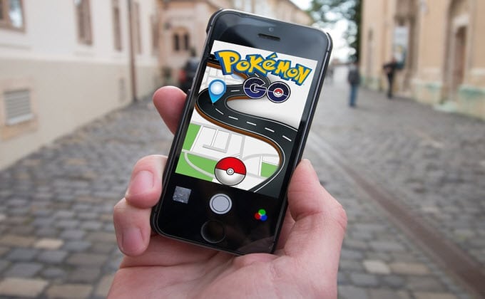 A person is captivated by the Pokémon Go craze as they hold up their phone.