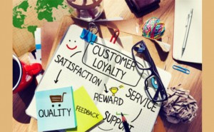 A notepad with the words customer loyalty strategies written on it.
