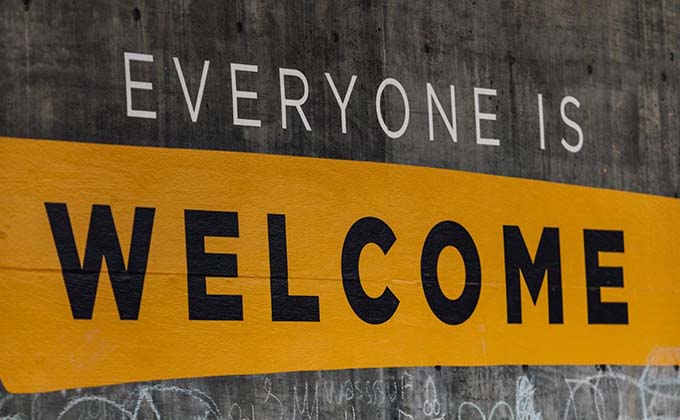 A sign that says everyone is welcome.