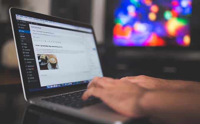 A person typing on a laptop.