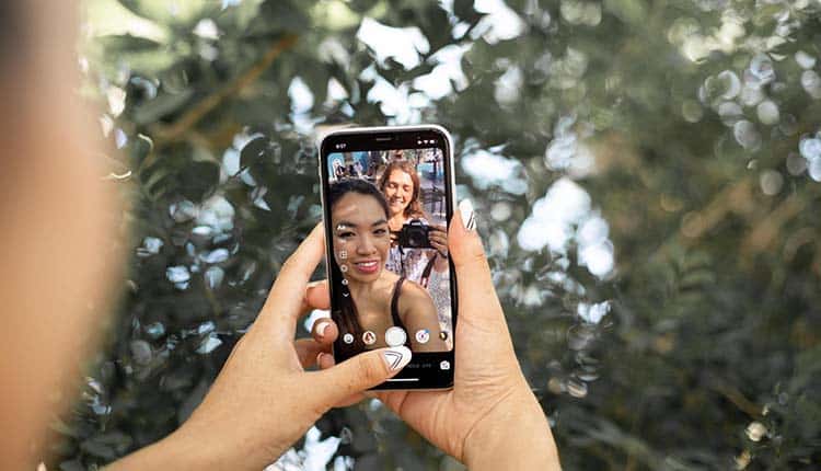 Two girls taking a picture.