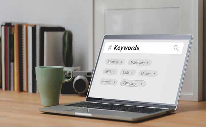 A laptop displaying #keywords.