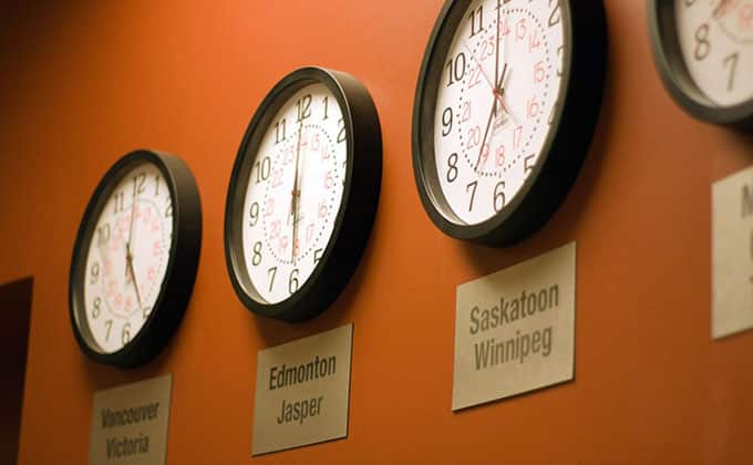A wall adorned with clocks showcasing different time zones.