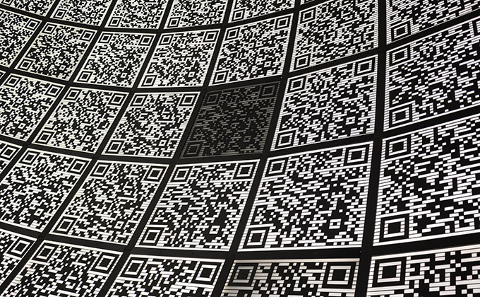 A grid of black and white QR Codes arranged in rows and columns